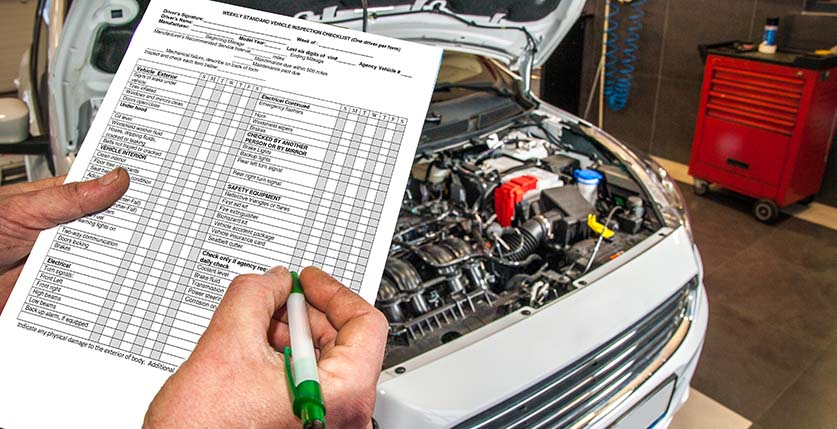 Vehicle safety inspection checklist beside an open engine bay